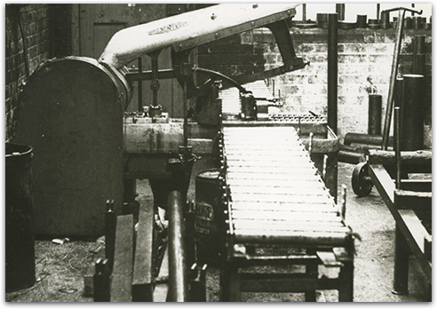 Close up
of the ends metal cylinders stacked on-top of one-another in a
warehouse